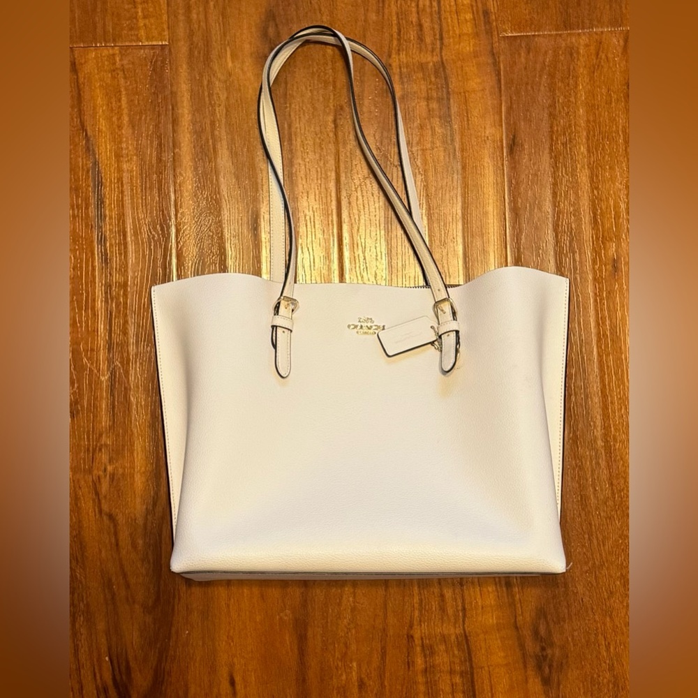 Coach , white tote bag .
